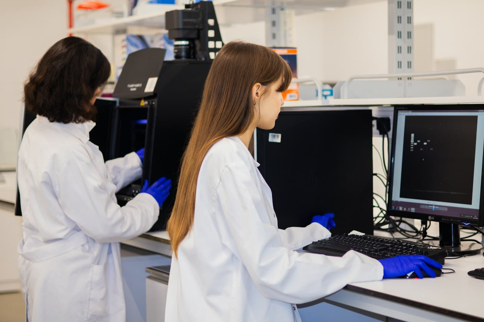 Analysts working in a quality control laboratory